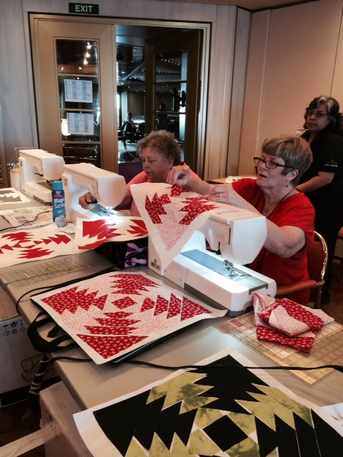 Carolyn and Carol Marchant sewing pineapples in Anita Grossman Solomon's class.